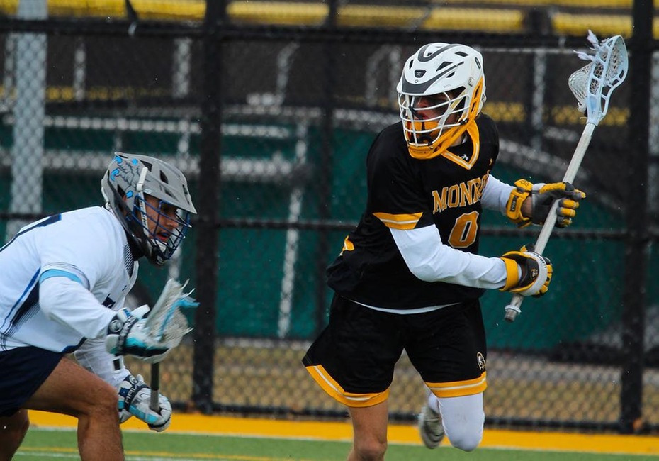 MCC Lacrosse Players is Defended by Harford player as MCC makes a run towards the net.